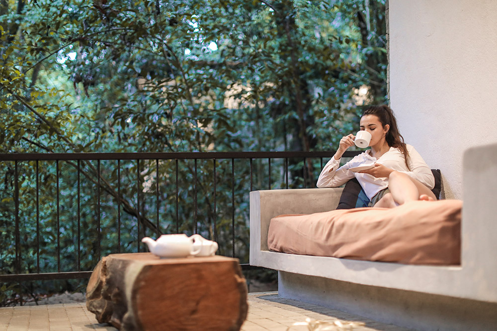 room with river deck and forest view